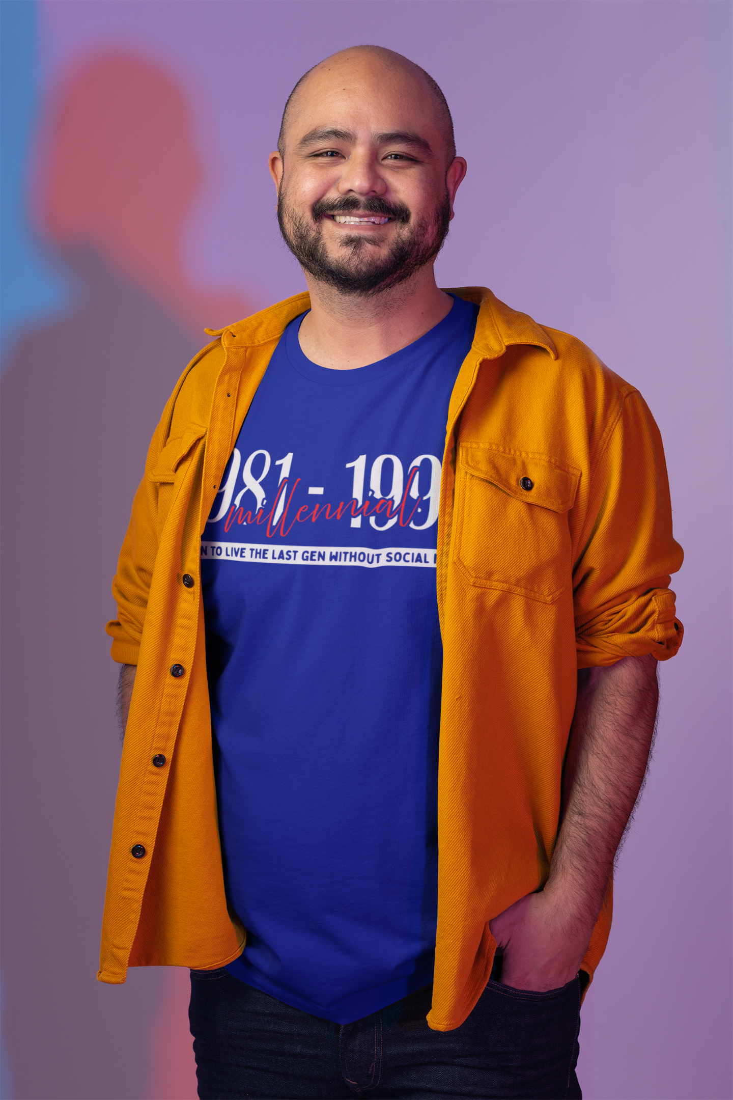 Man wearing a blue t-shirt with text and an orange jacket against a purple background