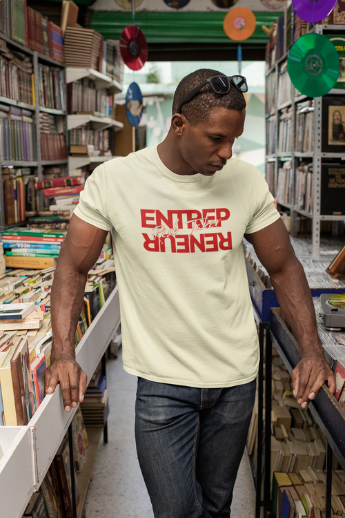Man wearing a 'ENTREPRENEUR' t-shirt in a bookstore