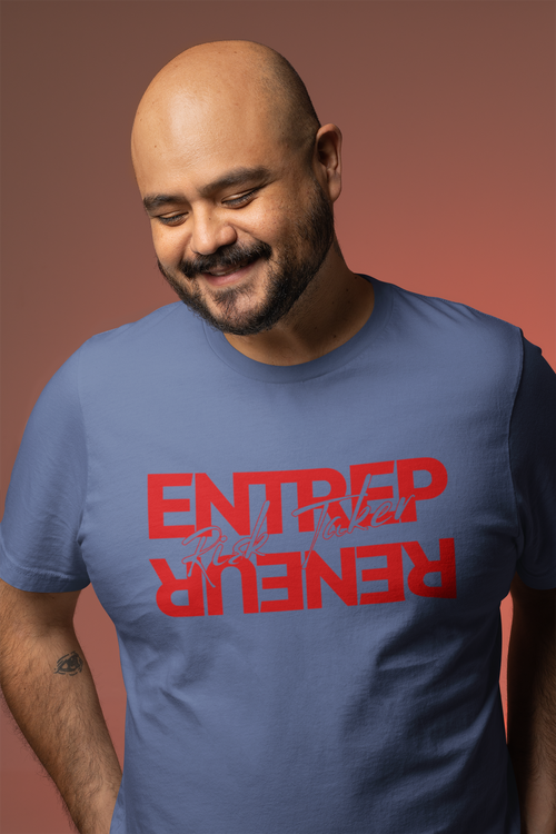 Man wearing a blue t-shirt with red text on a brown background