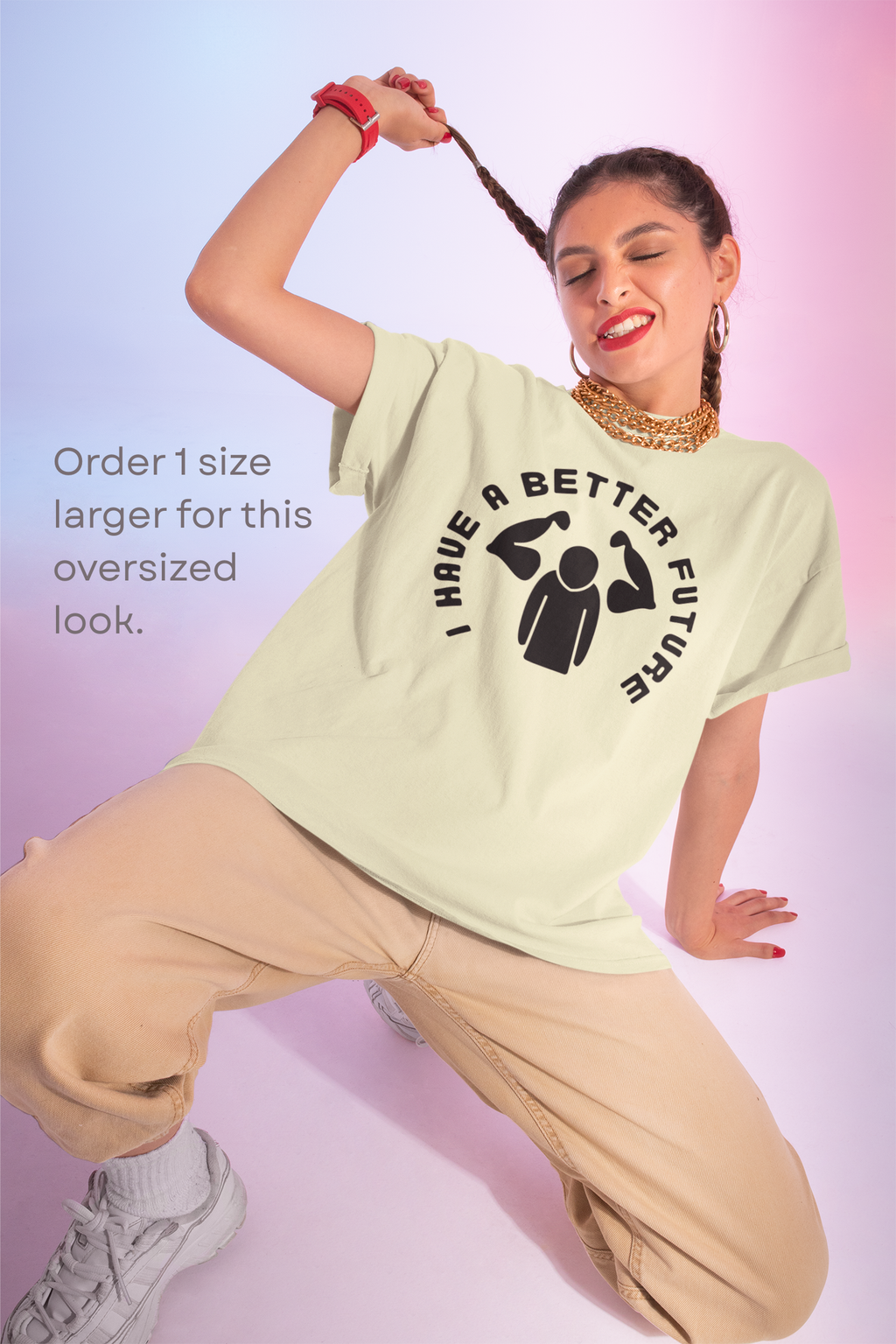 Woman wearing a light green t-shirt with a graphic design and text, posing against a gradient background.