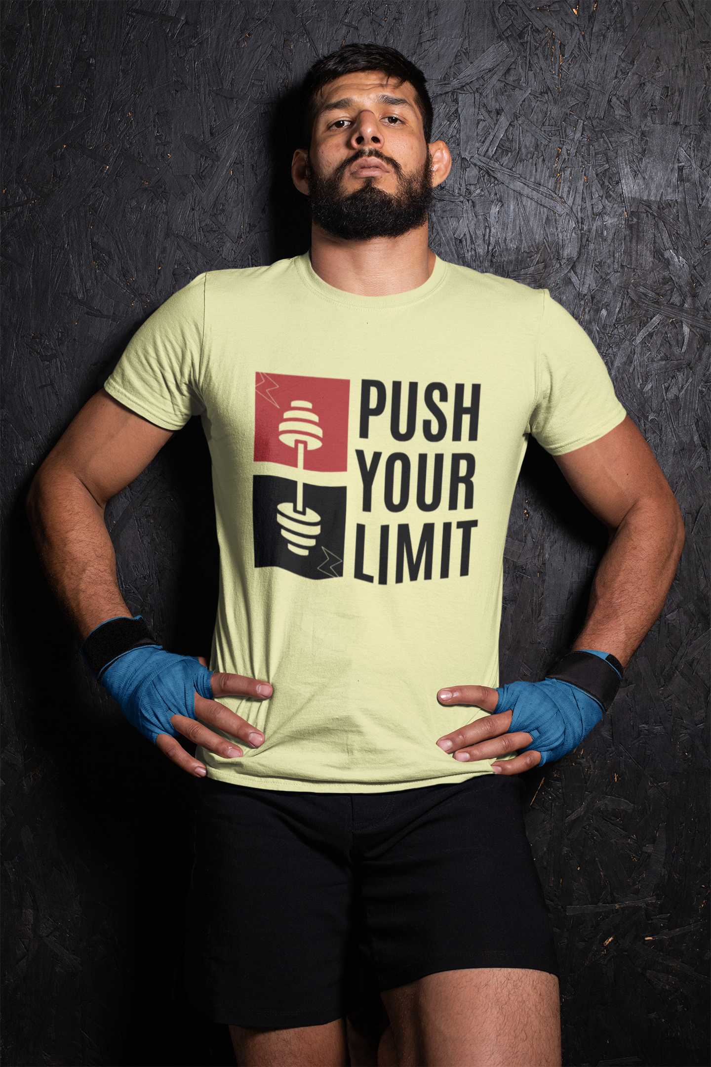 Person wearing a t-shirt with 'Push Your Limit' text against a dark background
