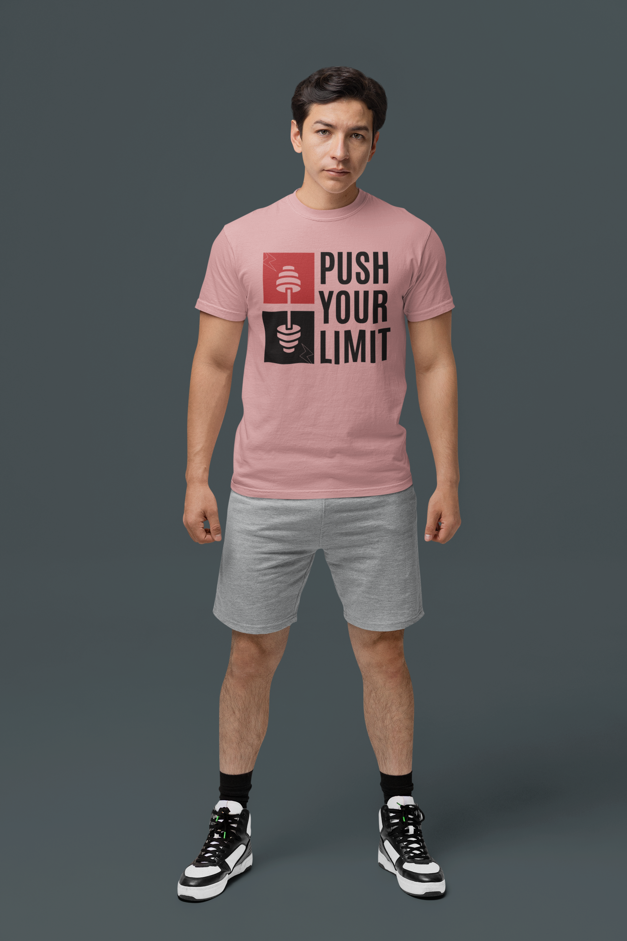 Person wearing a pink t-shirt with 'Push Your Limit' text on a dark background